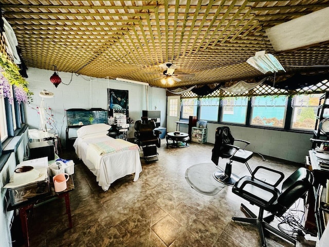 bedroom with concrete block wall