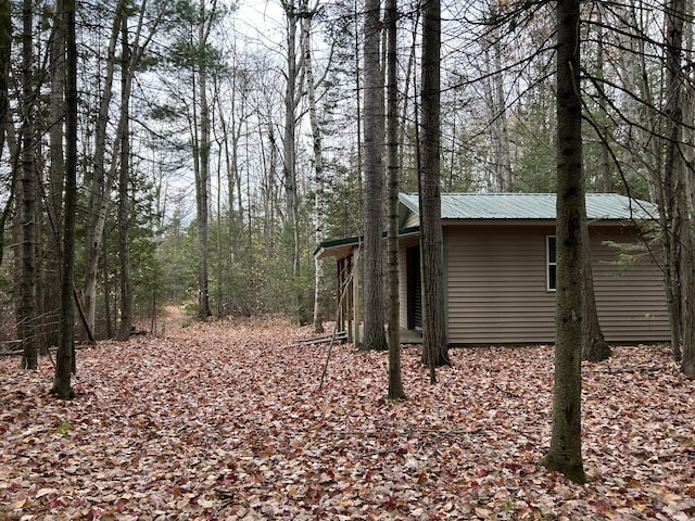 exterior space with a wooded view