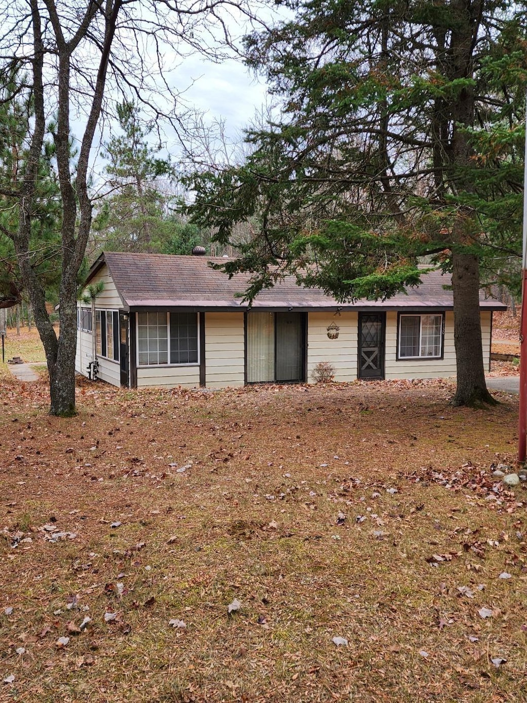 single story home with a sunroom