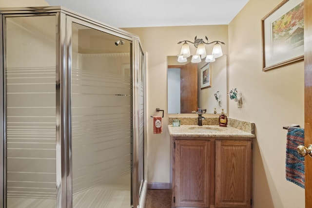 bathroom with vanity and a stall shower