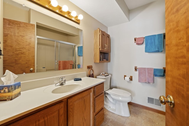 bathroom with visible vents, baseboards, toilet, a stall shower, and vanity