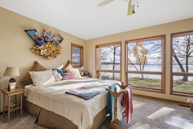 bedroom with baseboards, a ceiling fan, and carpet flooring