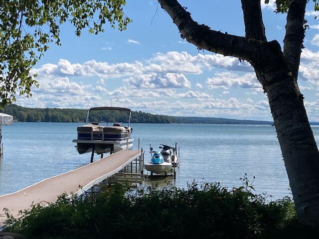 dock area featuring a water view and boat lift