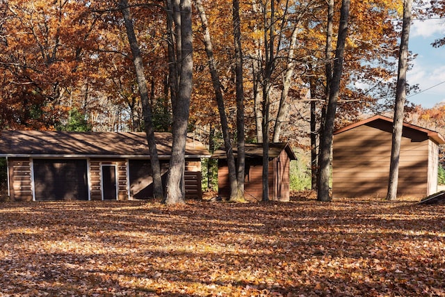 exterior space featuring an outbuilding and a garage