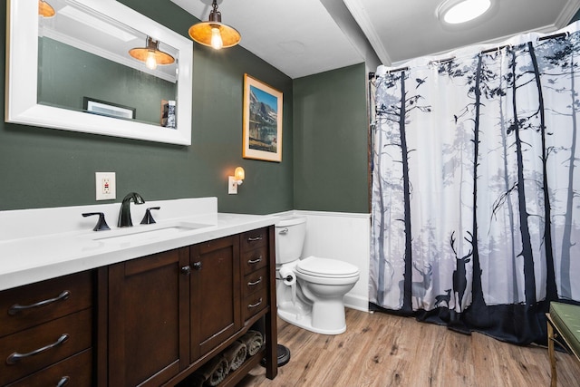 full bath featuring toilet, ornamental molding, a shower with curtain, wood finished floors, and vanity