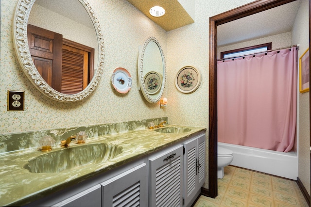 full bathroom featuring a sink, toilet, and wallpapered walls