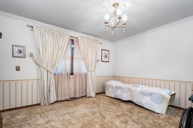 bedroom with carpet, an inviting chandelier, ornamental molding, and wainscoting