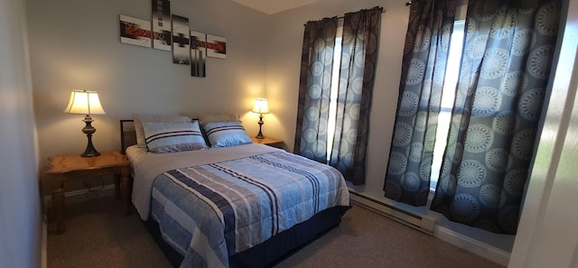 carpeted bedroom featuring baseboard heating