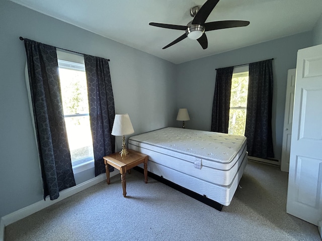 bedroom featuring baseboards, a ceiling fan, and carpet flooring