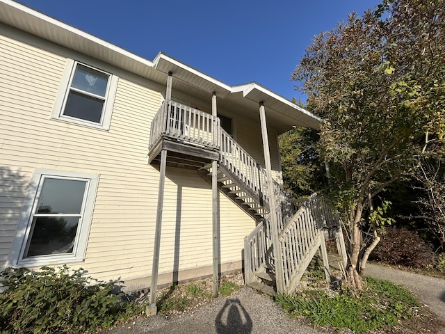 view of property exterior featuring stairs