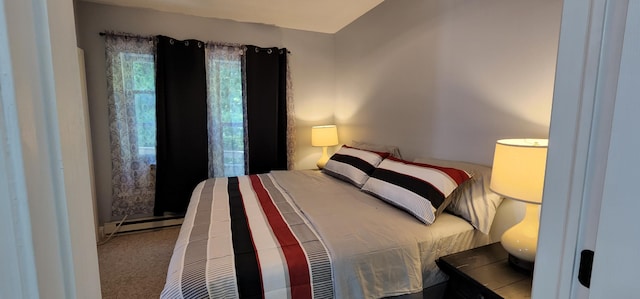 bedroom with carpet flooring and a baseboard radiator