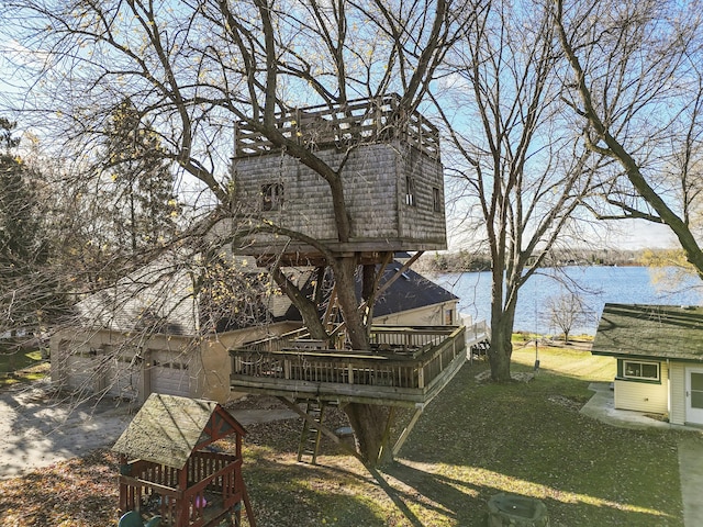 view of yard featuring a deck with water view