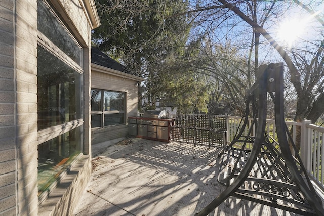 wooden deck with grilling area