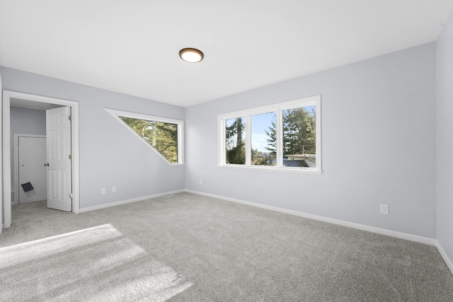 unfurnished bedroom with baseboards and carpet floors