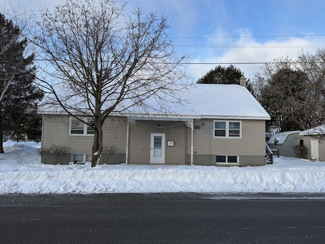 view of front of home featuring a chimney