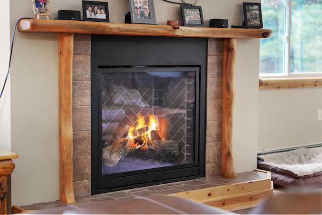 interior details with a tiled fireplace