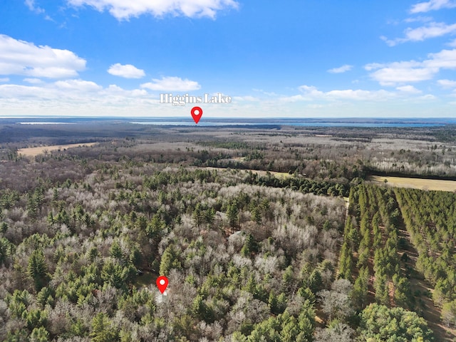 birds eye view of property with a wooded view