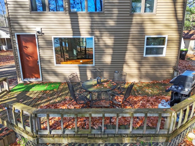 exterior space with outdoor dining space and a deck