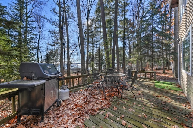 wooden terrace with outdoor dining space