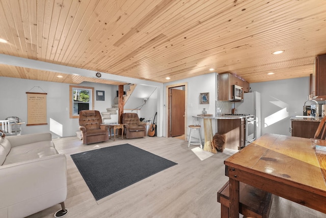 living area with stairway, recessed lighting, wooden ceiling, and light wood-style floors