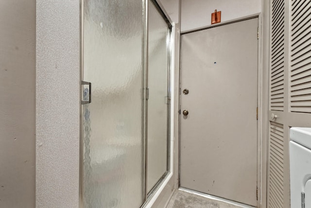 bathroom with a stall shower