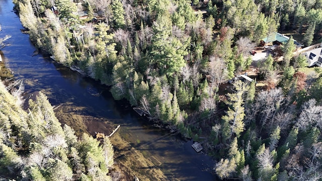 drone / aerial view featuring a forest view