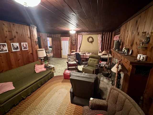 carpeted living room with wooden walls and wooden ceiling