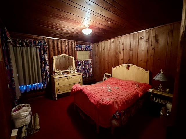 bedroom featuring wooden walls and wooden ceiling