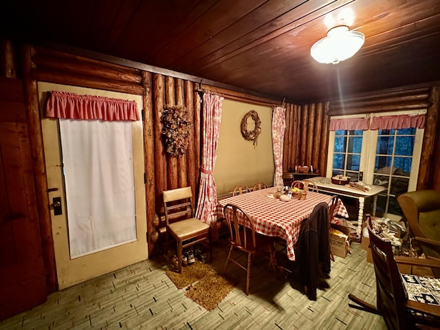 dining room featuring wooden ceiling and wood finished floors