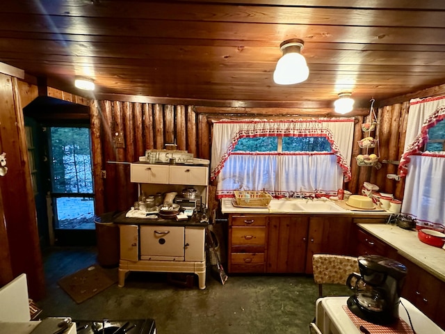 kitchen with a sink, brown cabinets, and wood ceiling