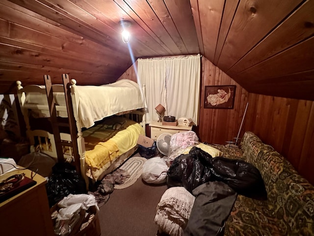 bedroom featuring carpet flooring, lofted ceiling, wood walls, and wooden ceiling