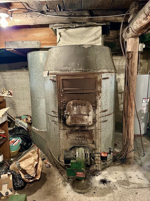 utility room featuring electric water heater