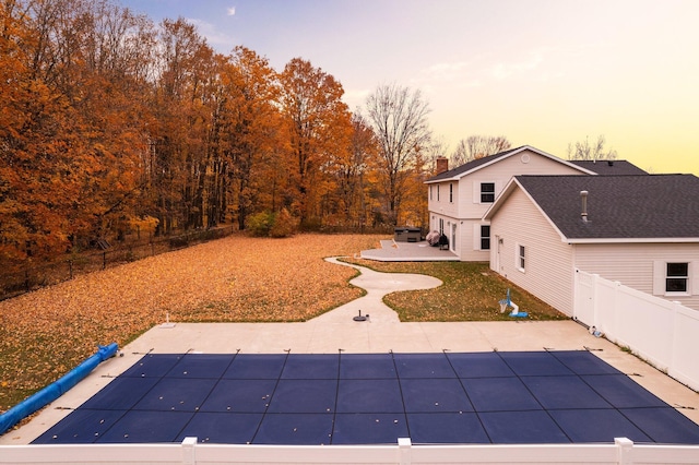 view of yard with a fenced backyard, a fenced in pool, and a patio