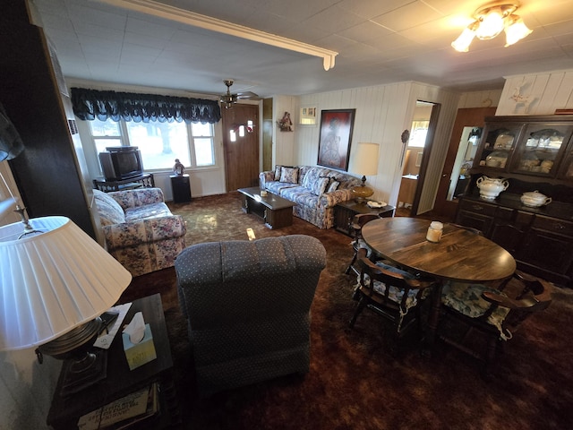 carpeted dining room featuring a ceiling fan