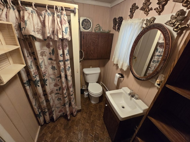 full bathroom with wooden walls, curtained shower, visible vents, toilet, and vanity