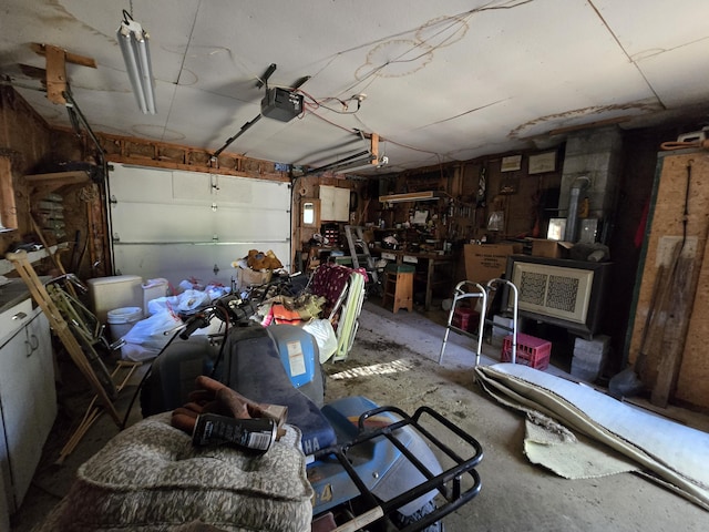 garage with a wood stove and a garage door opener