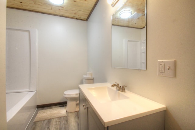 full bathroom featuring toilet, a tub to relax in, wood finished floors, wooden ceiling, and vanity