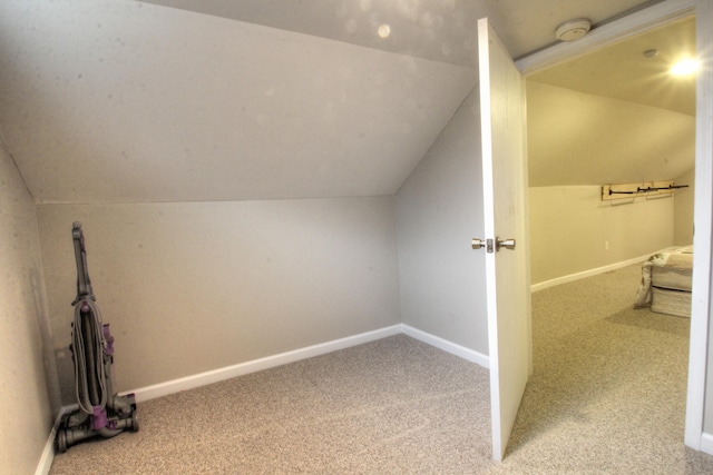 bonus room featuring carpet flooring, lofted ceiling, and baseboards