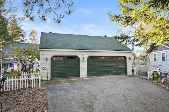 garage featuring fence