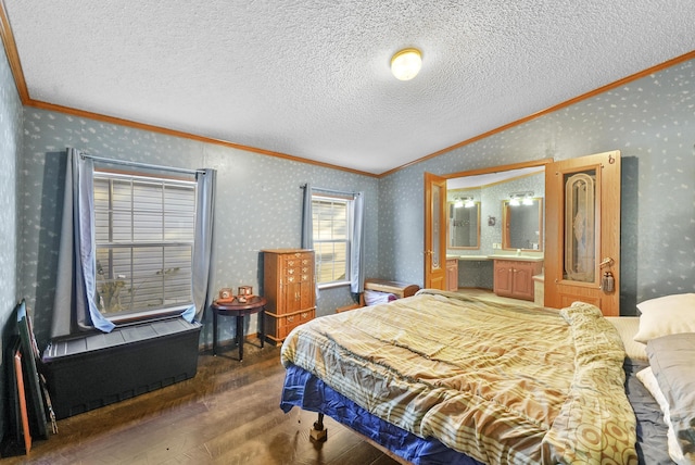 bedroom with wallpapered walls and ornamental molding