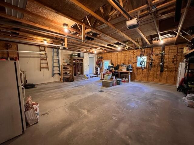 garage with freestanding refrigerator