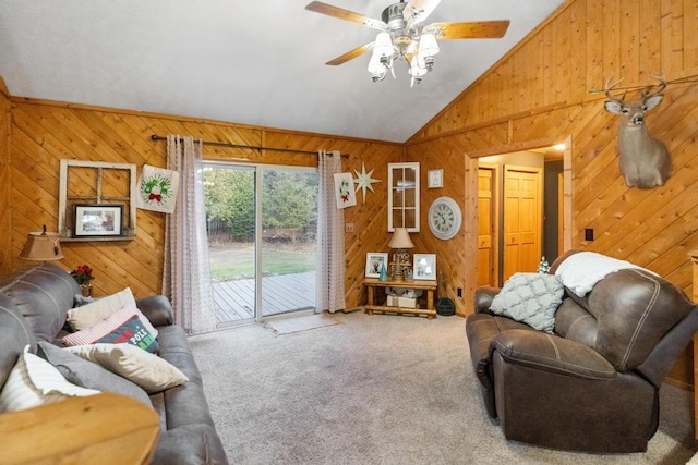 carpeted living area with wood walls, a ceiling fan, and vaulted ceiling