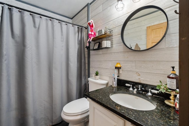 bathroom featuring vanity, curtained shower, toilet, and wood walls