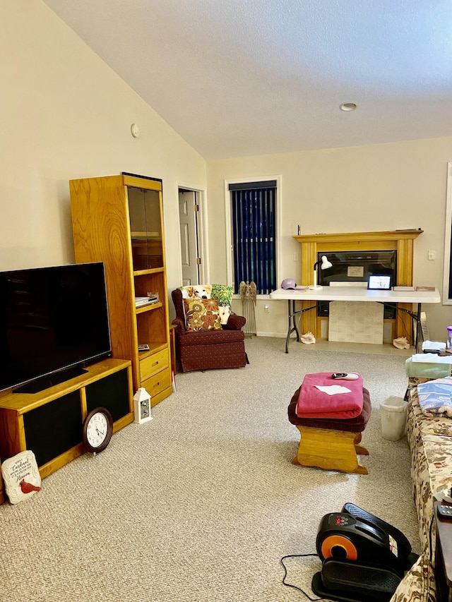 carpeted living area featuring vaulted ceiling