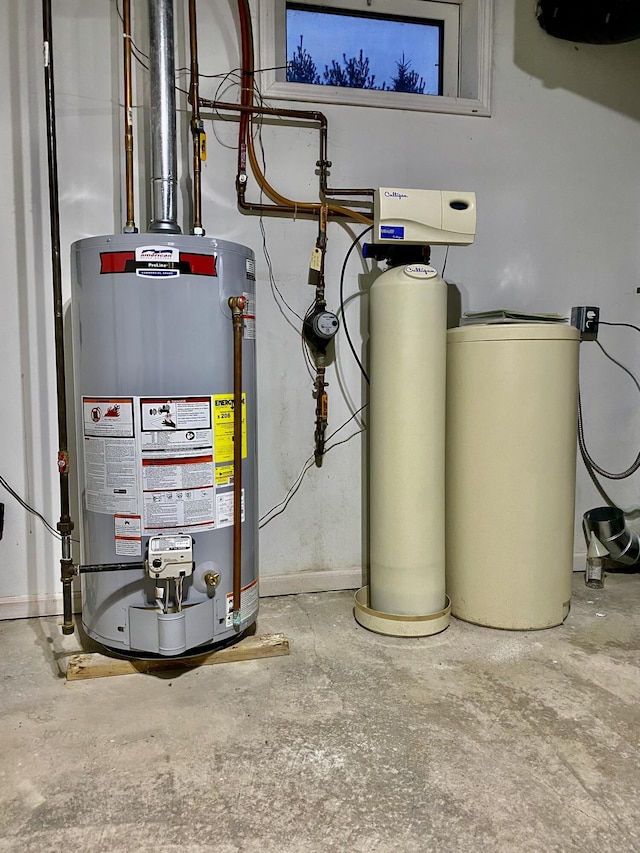 utility room featuring water heater