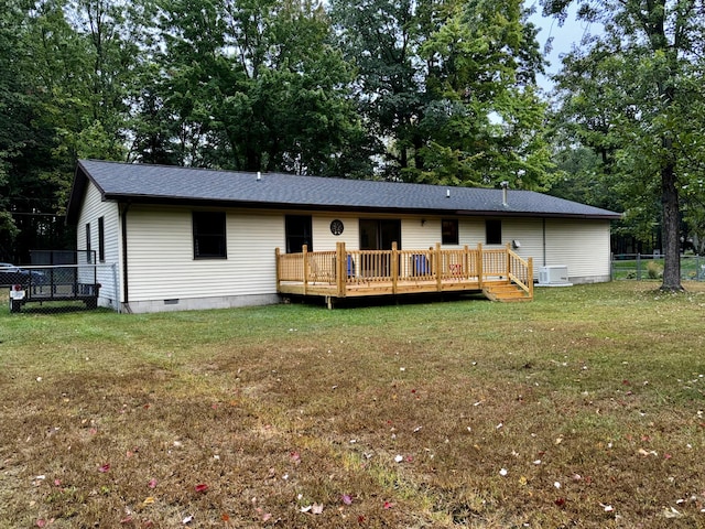 view of front facade featuring a deck, fence, a front yard, a shingled roof, and crawl space