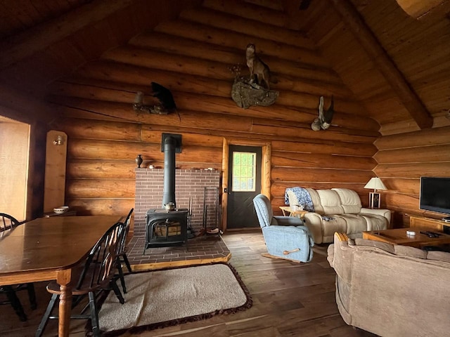 living area featuring beamed ceiling, a wood stove, rustic walls, high vaulted ceiling, and wood-type flooring