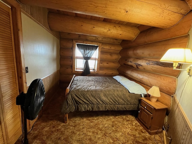 carpeted bedroom featuring log walls