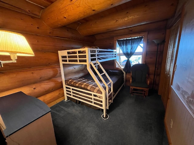 carpeted bedroom featuring log walls