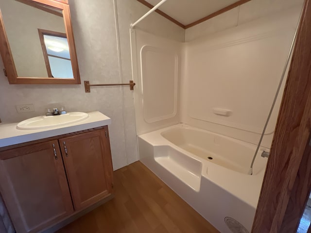 bathroom featuring shower / bath combination, wood finished floors, and vanity